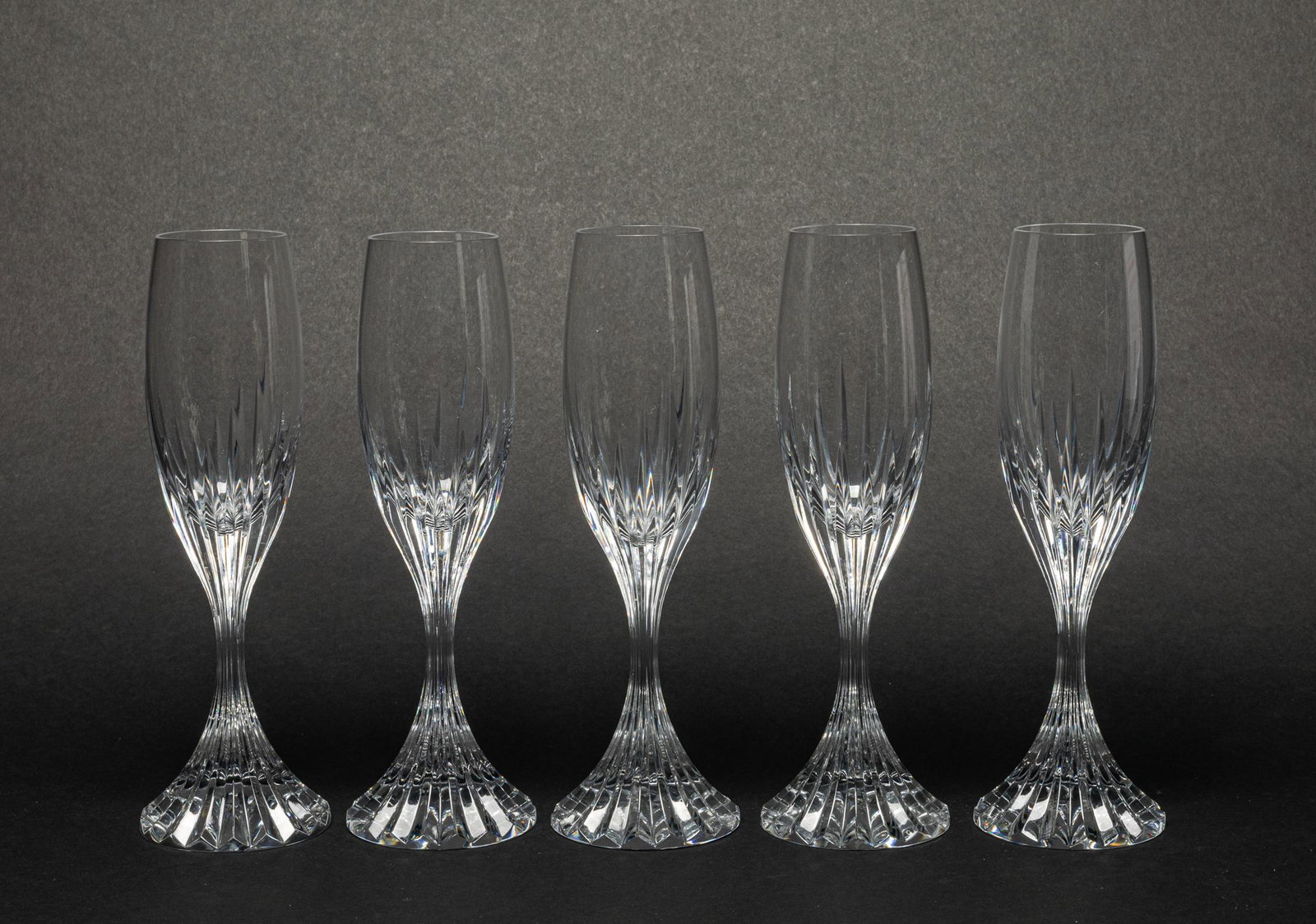 Baccarat Massena Crystal Glass Champagne Flutes: Set of 5 Baccarat Massena champagne flute glass, the deep orgue bevel cuts are etched directly into the clear crystal, irradiating from the foot of the glass to the base of the narrow bowl, each botto