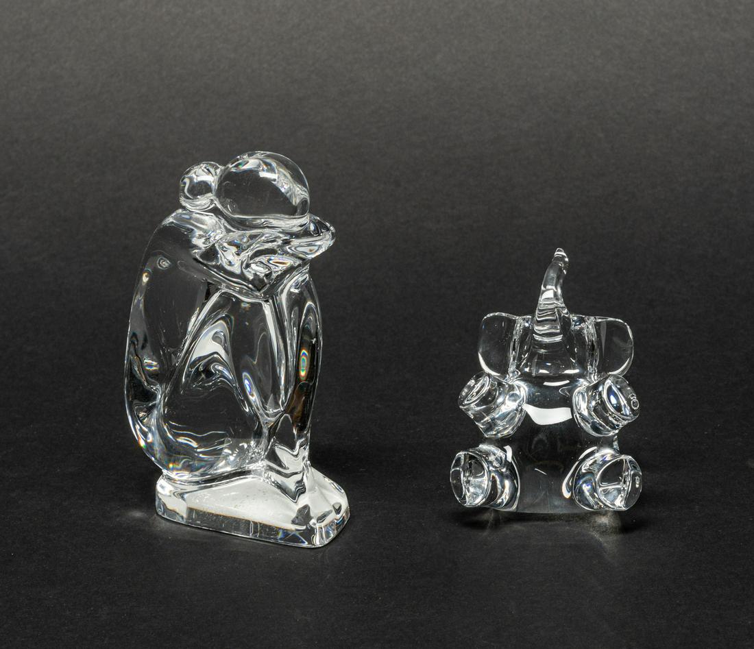 Baccarat Crystal Glass Sculpture: Two Collectible Baccarat clear crystal glass table sculpture, one modeled in elephant form marked Baccarat France, the other as a crying figure marked Baccarat RRigot. 4.3inch H, 2.9inch L, 1.8inch W 