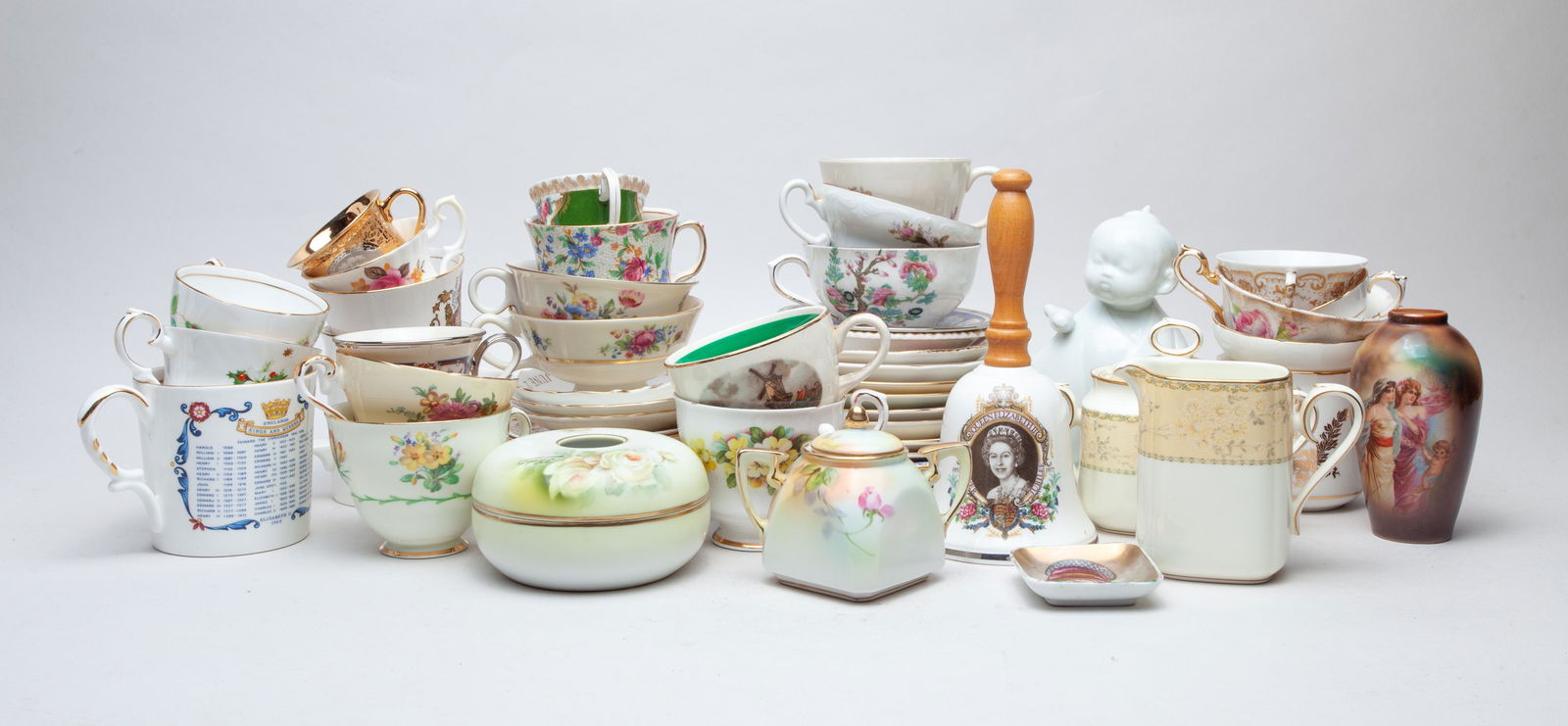 Collectible Porcelain Tea Cups & Decors: A large group of exquisite porcelain tea cups, saucers, tea pots, sugar bowls, creamers and room decors, about 54 pieces in total. 7.3inch H, 3.7inch W (largest).