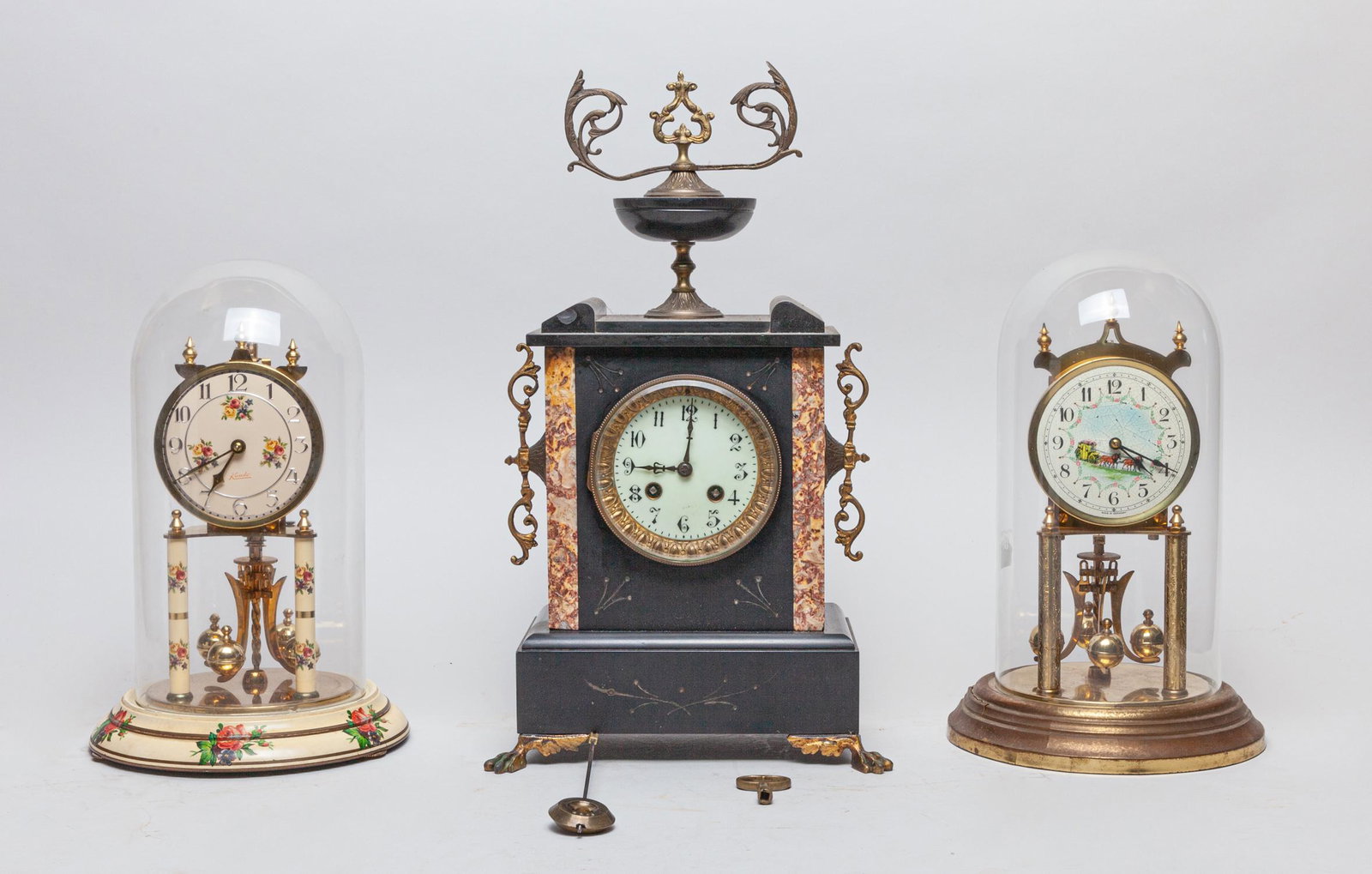 Collectible Table Clocks: Including a black vintage table clock and two 400 day anniversary clocks. Approx. 8-12inch (largest).