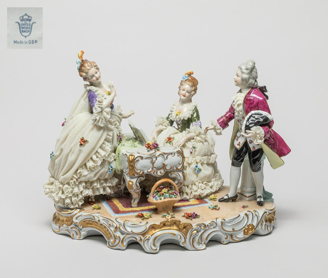 Collectible Large Germany Unter Weiss Bach Figure: Rare delicate porcelain figure sculpture, modeled as three figures playing the piano and dancing, the bottom marked Unter Weiss Bach Germany. 11.5inch L, 8inch W, 9.6inch H.