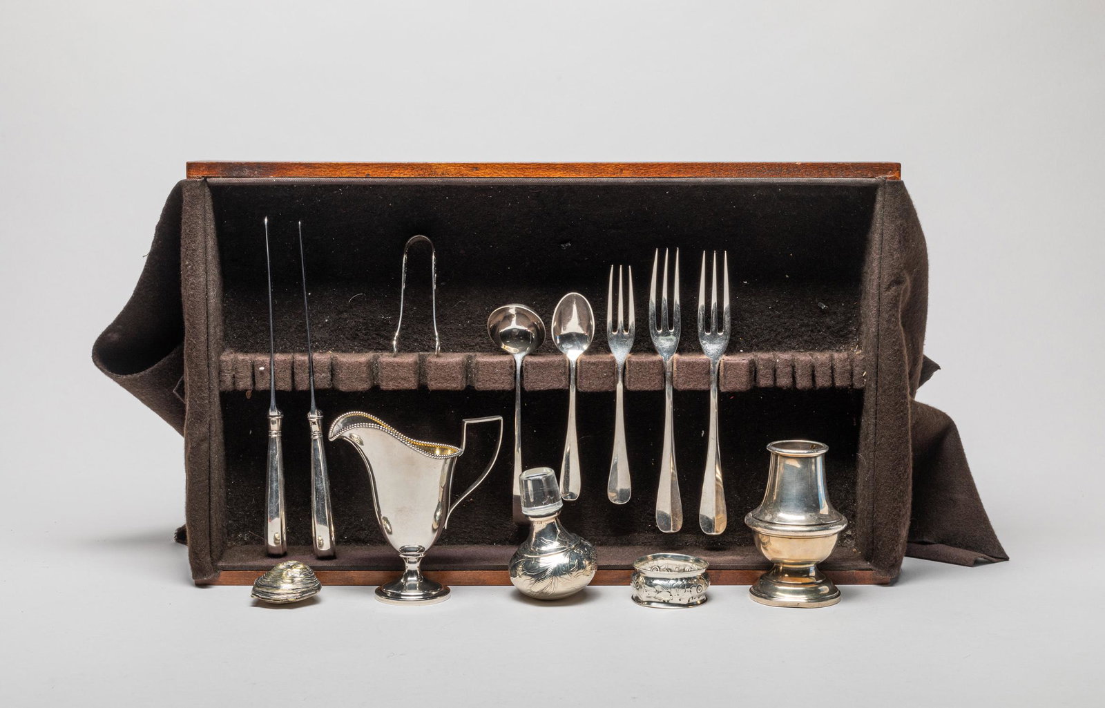Collectible Sterling Silver Service With Wood Tray: Including 3 forks, 2 spoons, 2 knives, a tong, a creamer, a jar and a shell type decor, with a wood tray. 4.5inch L, 2.25inch W, 4.25inch H (largest).