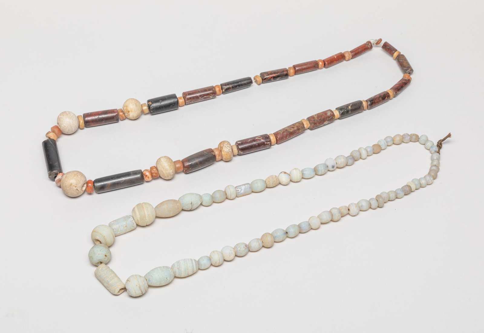 Antique African Hand Made Bead Necklace: Two special African style hand made large agate bead necklaces, one in translucent hue, the other beads in beige, russet and dark brown colors. 34inch L (larger).