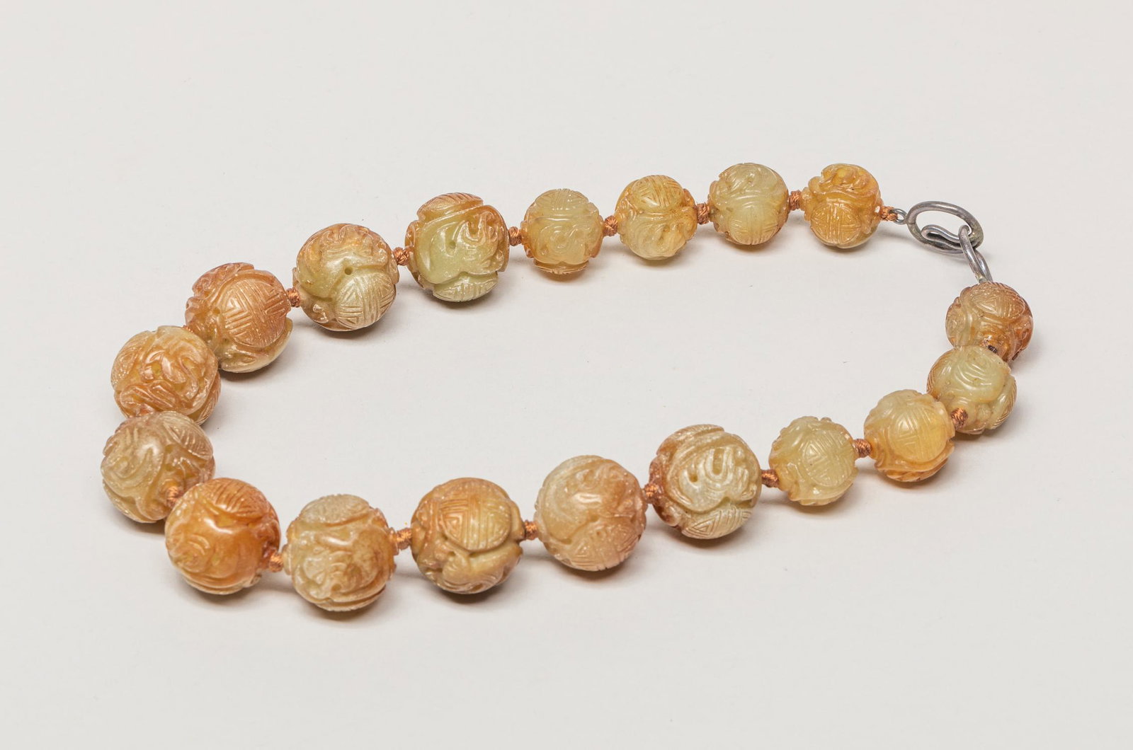 Chinese Large Bead Carved Jade Stone Necklace: Collectible large russet jade stone bead necklace, each of the 18 beads carved with a pair of bats surrounding two shou characters. 18inch L.