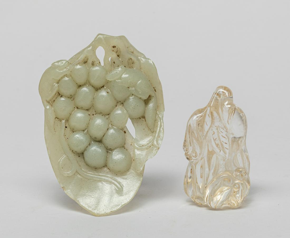 Chinese Jade & Rock Crystal Carvings: The clear rock crystal carving worked in the form of a large buddha hand fruit issuing a leafy stem with a smaller attendant buddha hand, a bat resting on the fruit, the celadon jade carving carved as