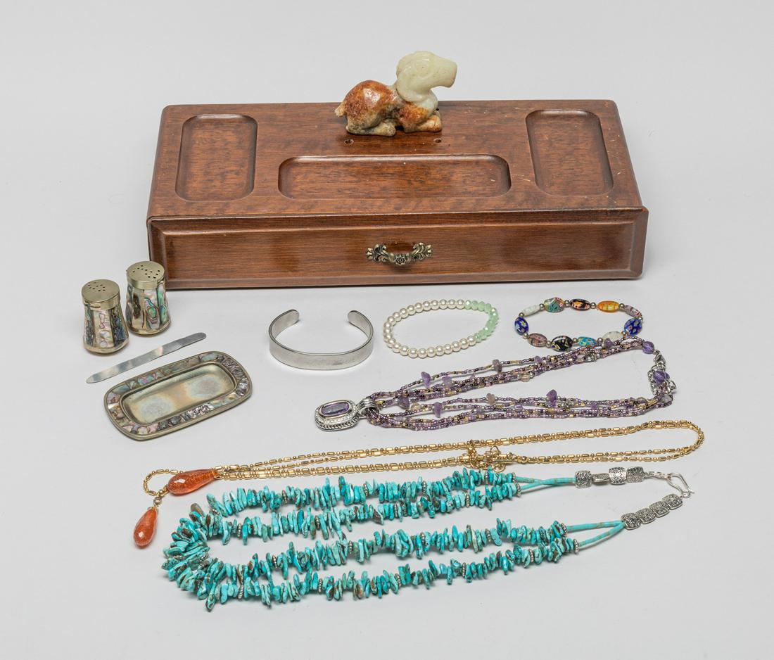 Estate of Costume Jewelry: Including a bangle, a mother of pearl shaker set, 2 bead bracelets, a turquoise necklace and an amethyst necklace, with a wood jewelry box with a russet jade/stone carved goat finial. 12.5inch L, 5.2i