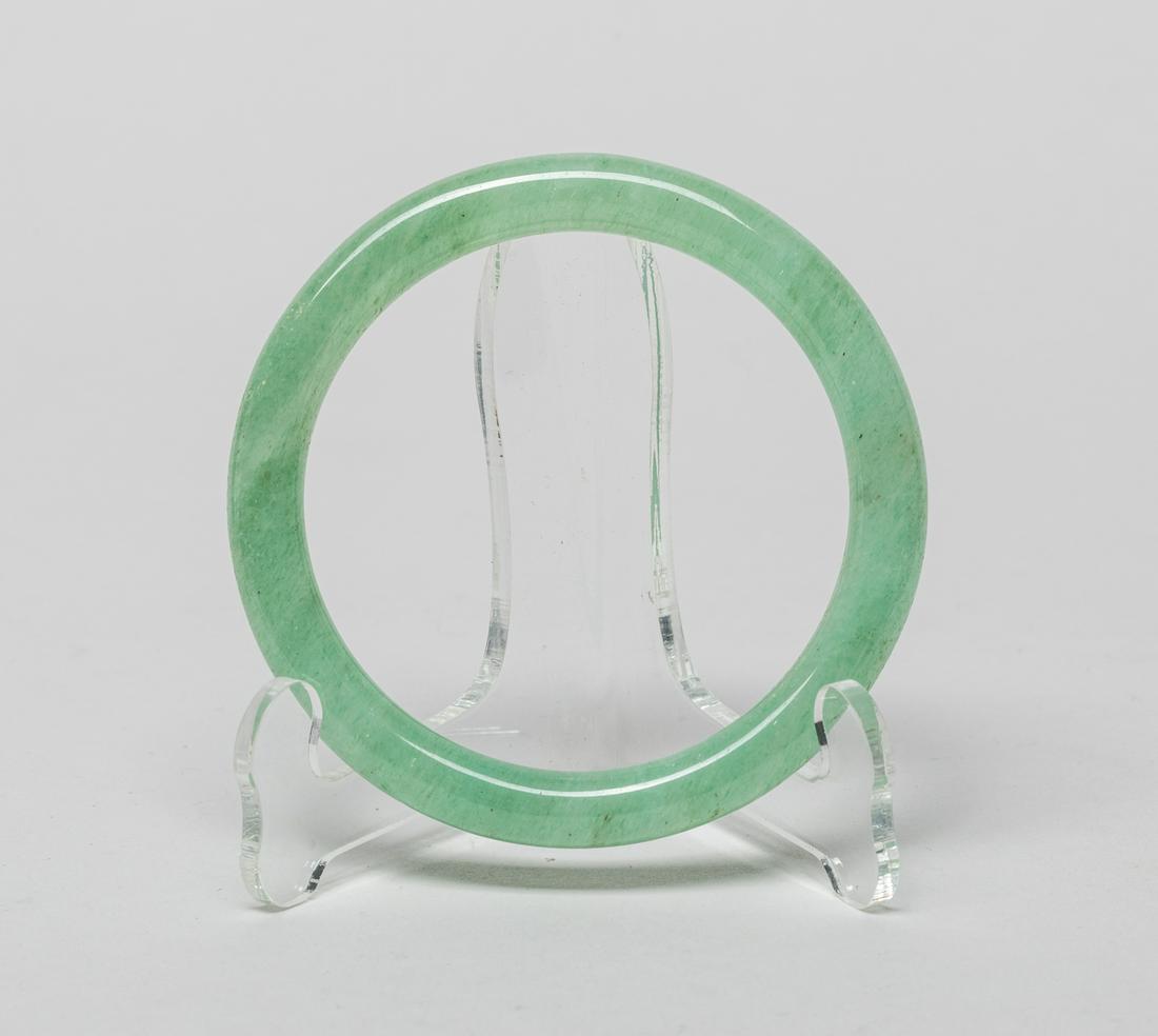 Rare Chinese Translucent Bangle: Collectible translucent celadon jade circular bangle. 3.18inch outer diameter, 2.47inch inner diameter.