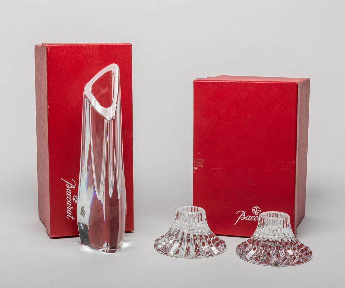 Baccarat Crystal Vase & Candlesticks: Including a contemporary style crystal glass vase and a pair of candlestick holders, each marked Baccarat France, with cardboard boxes. 8.5inch H, 2.4inch W (vase size).