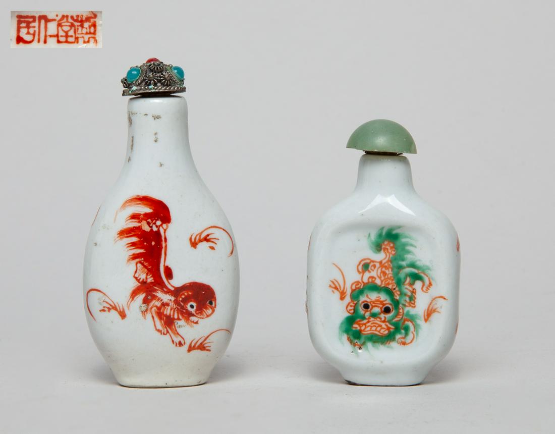 Chinese Coral Red Porcelain Snuff Bottle: One of flattened ovoid form, the other of rounded square form, both painted with an iron-red or green foo dog to either side, with stoppers. 3.1inch H, 1.5inch W (larger).