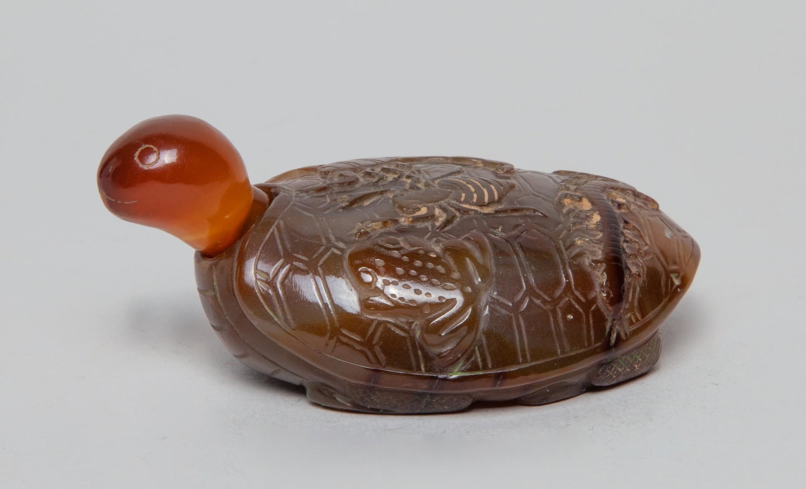 Special Chinese Large Agate Snuff Bottle: Overall carved in the tortoise form, the shell back with a frog, a spider, a scorpion, a snake and a centipede, with a head type stopper. 3.7inch L, 2.3inch W, 1.6inch H.