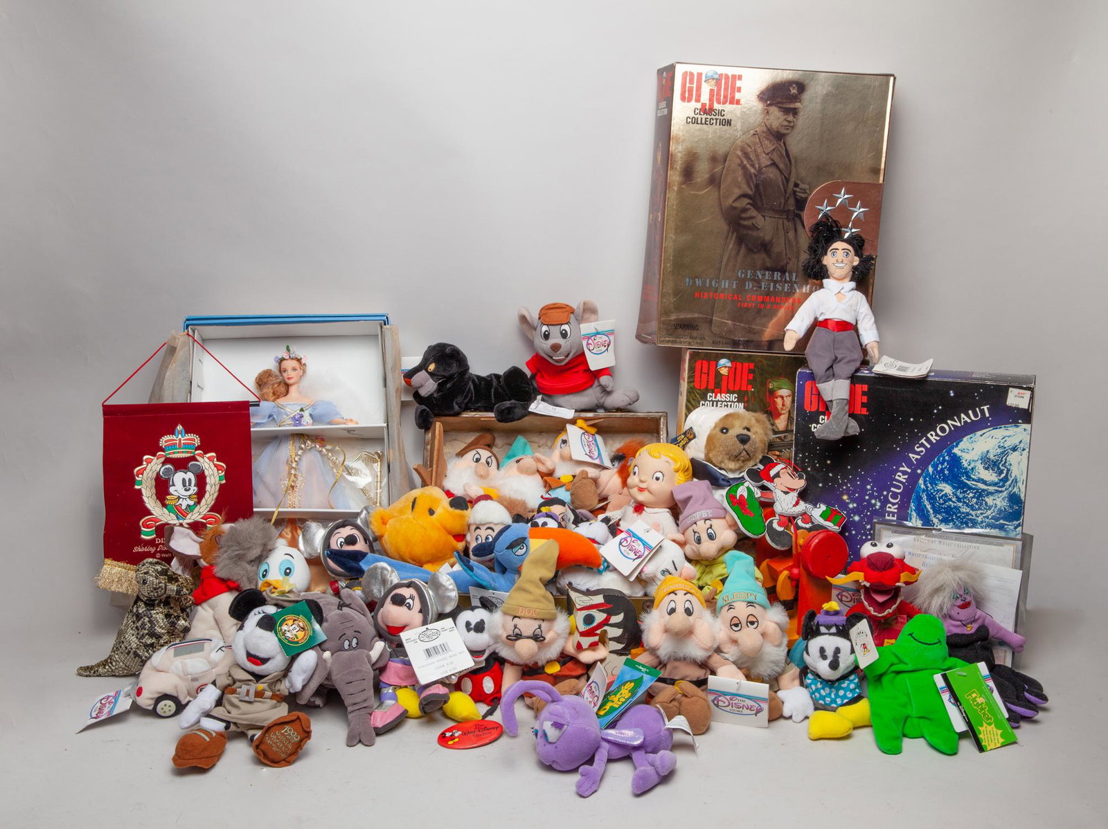 Collectible Disney, Gi Joe & Barbie Dolls: A large group of Disney toys and decors, GI Joe Sculptures and Barbie doll. Size varies.