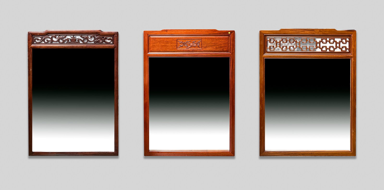Large Chinese Rosewood Wall Hanging Mirror: Group of three large Chinese style wall hanging rosewood framed glass mirrors. 29inch W, 43.25inch H (largest).