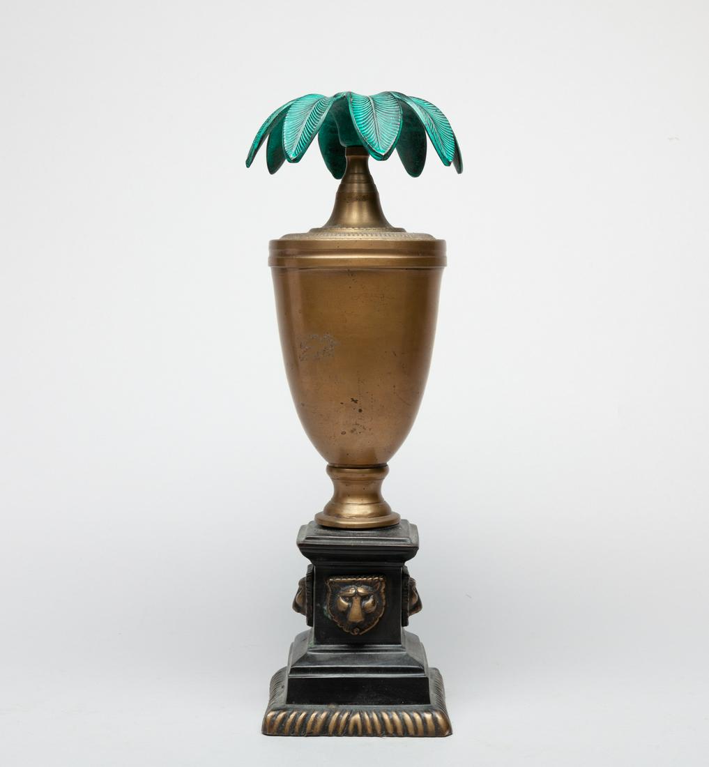 Mid-century Bronze Palm Tree Candle Stick: Decorative brass candlestick holder, molded as a urn above a square base, with a flaring tree-shaped top. 13.5inch H, 4.7inch D.