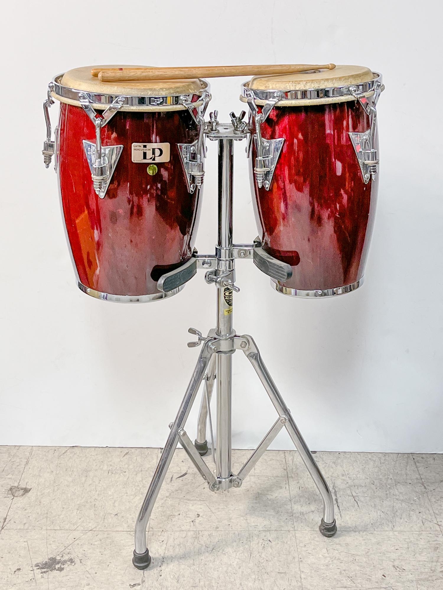 Latin Percussion Drums: Collectible Latin Percussion drums, 2 pcs on stand, with 2 drumsticks. 36inch H, 22inch W, 9.5inch W.