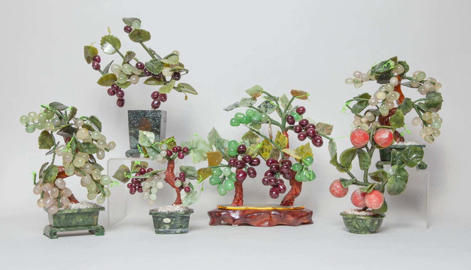 Chinese Export Jade/Stone Bonsai: Group of six collectible Chinese bonsai, the artificial litchi and grape branches issuing from jade stone planters. Approx 10x11inch (largest).