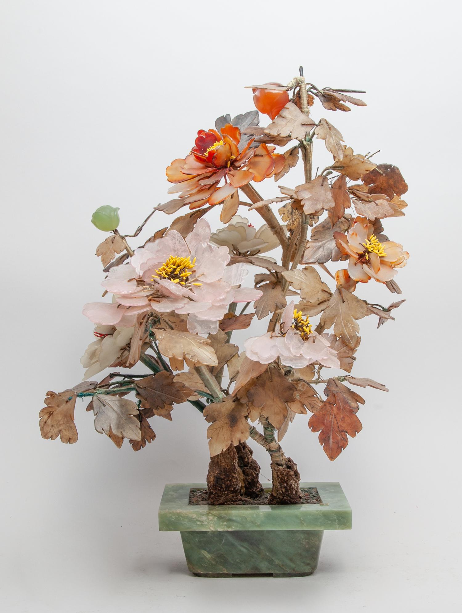 Large Chinese Jade & Gemstone Bonsai: Large collectible jade and gemstone bonsai, with agate and rose quartz flowers and jade leaves, supported on a translucent jade planter. Approx. 15inch L, 12inch W, 20inch H.