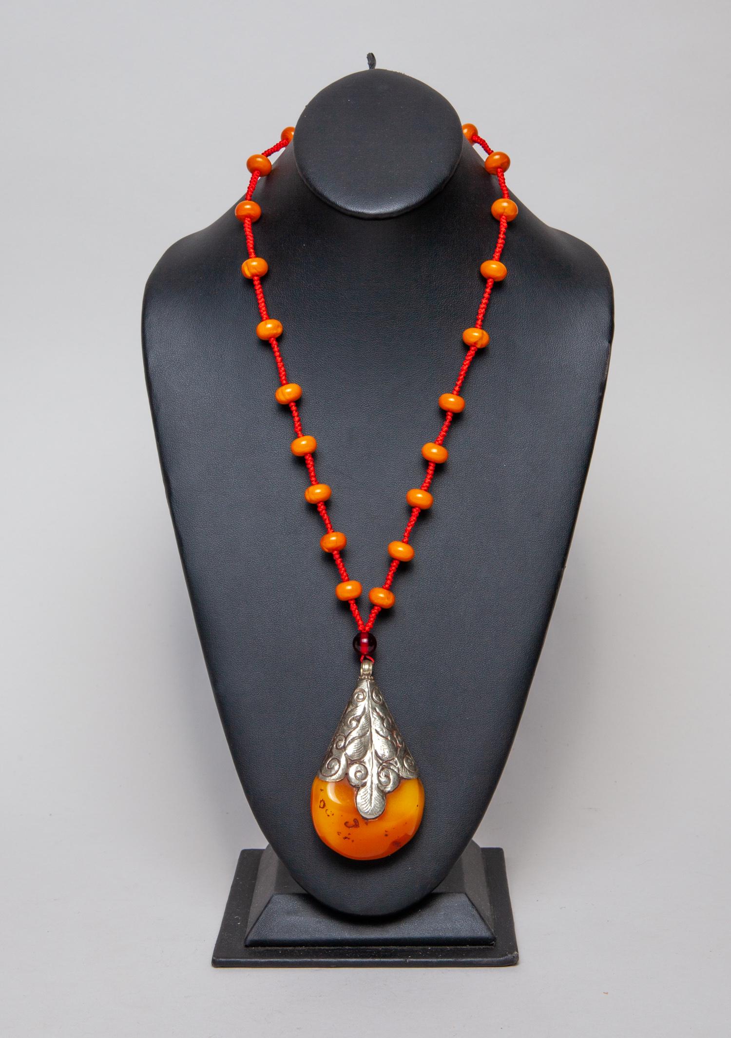 Tibetan Amber Bead Like Necklace w/ Drop Bead: Collectible Tibetan style amber like bead necklace with a large drop amber like pendant. 24inch L.