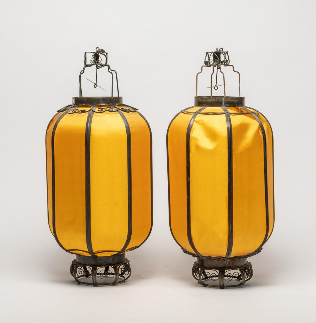 Pair Chinese Brass Hanging Lamp: A pair of Chinese type yellow silk and brass hanging lamps. 15.5inch H, 7.5inch W (each).