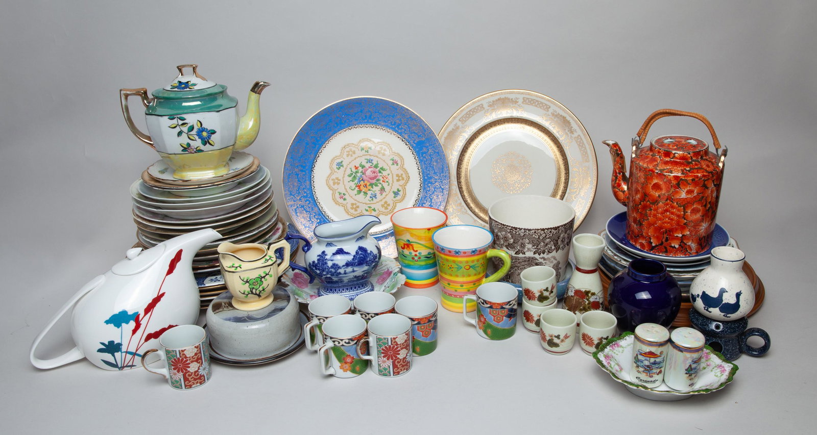 Estate Large Group Porcelain Service: Large group of porcelain plates, teapots, jars and cups with floral pattern. 11inch D(largest)