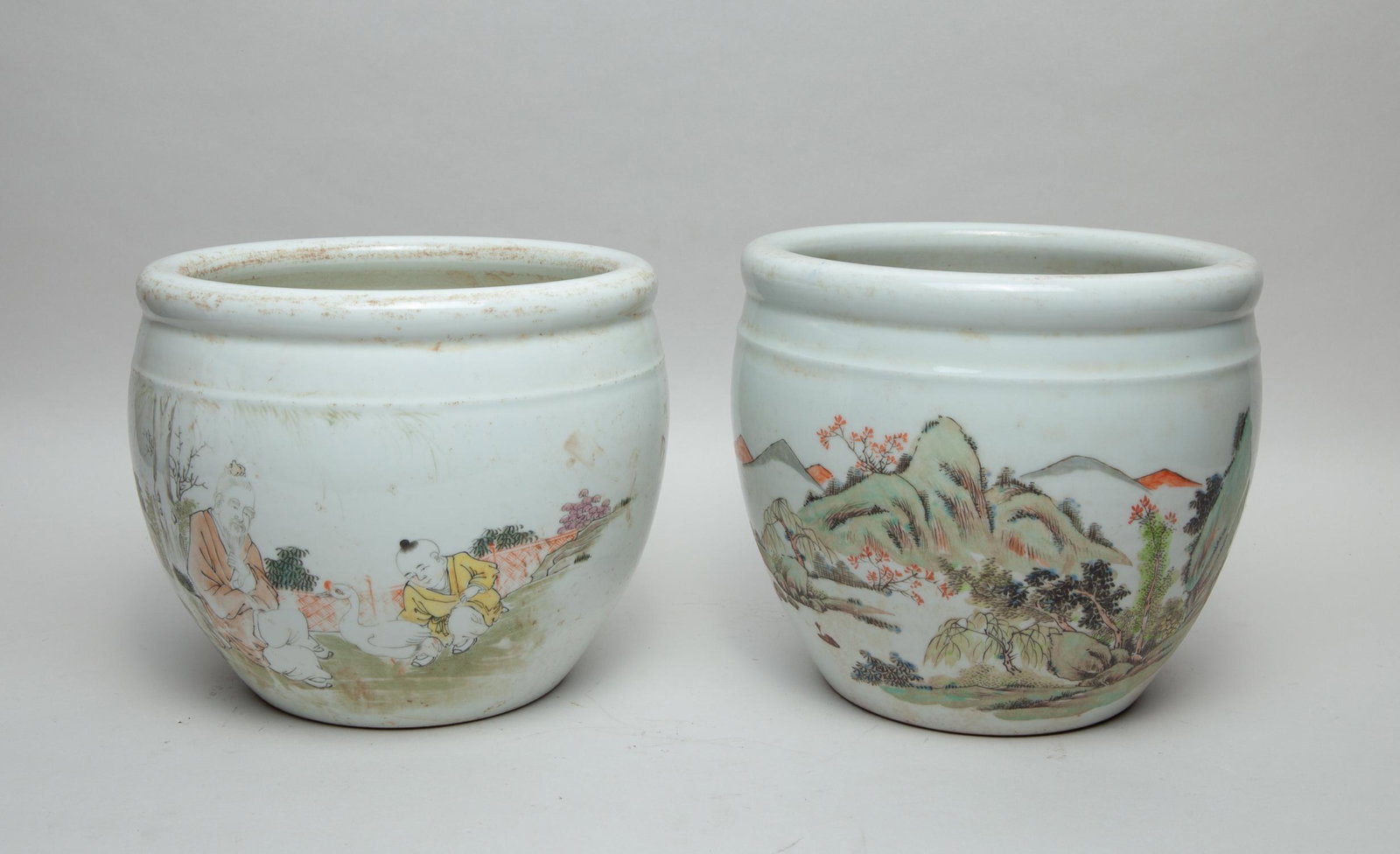 Pair Chinese Famille Rose Porcelain Pot: Of ovoid form, the exterior decorated with hand painted figures in landscape. 10inch W, 8.5inch H (each).