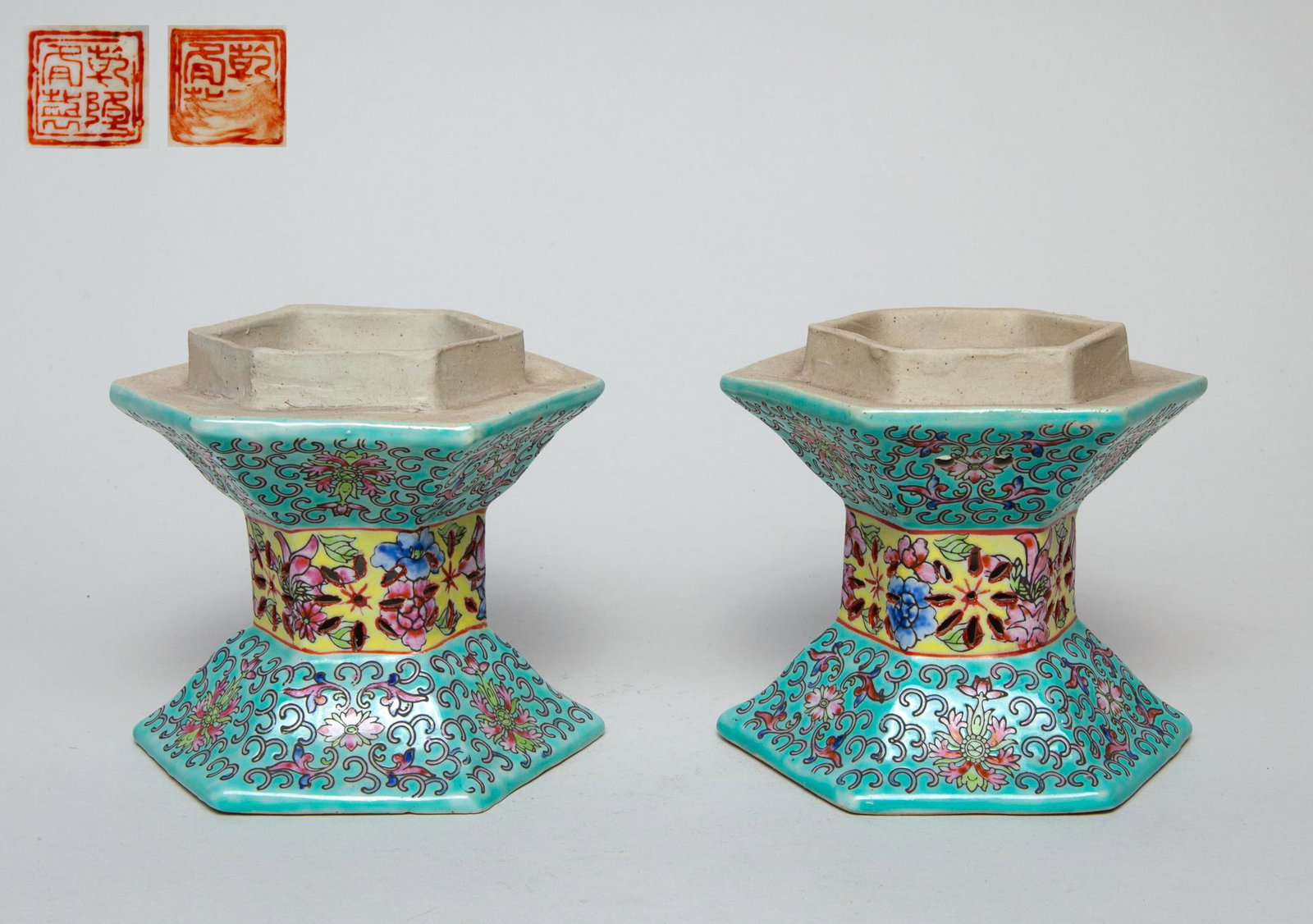 Pair Chinese Porcelain Lamp Base: Each of hexagonal section, the exterior enameled with lotus scrolls on a turquoise ground divided by a band of flowers on yellow ground, the bottom with a seal mark. 4.5inch H, 5.1inch W (each).