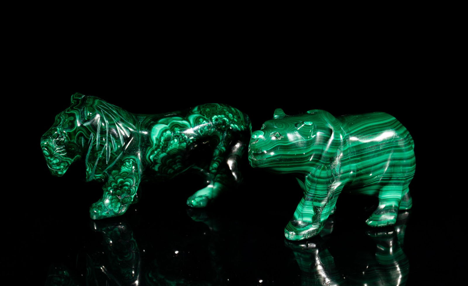 Collectible Malachite Table Sculpture: Two malachite table sculptures carved in lion and bear form, the surface finely soothed and polished. 2inch H, 3.9inch L, 0.97inch W (larger).