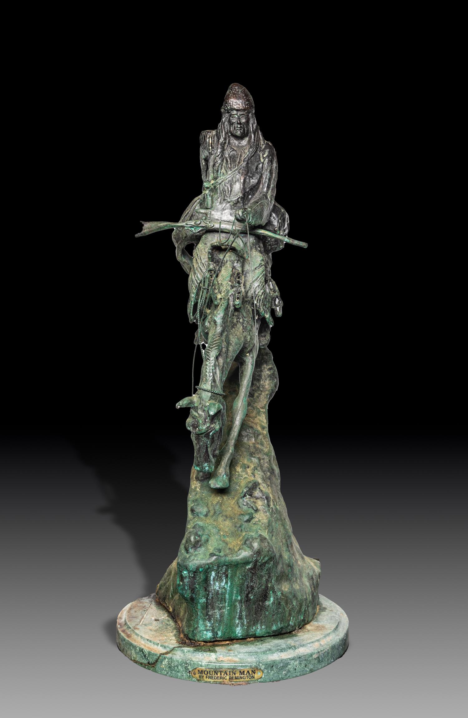 Mountain Man After Remington: Collectible table sculpture modeled as a figure riding on a horse holding a long gun, the marble base marked Mountain Man by Frederic Remington. 28inch H, 12inch W.