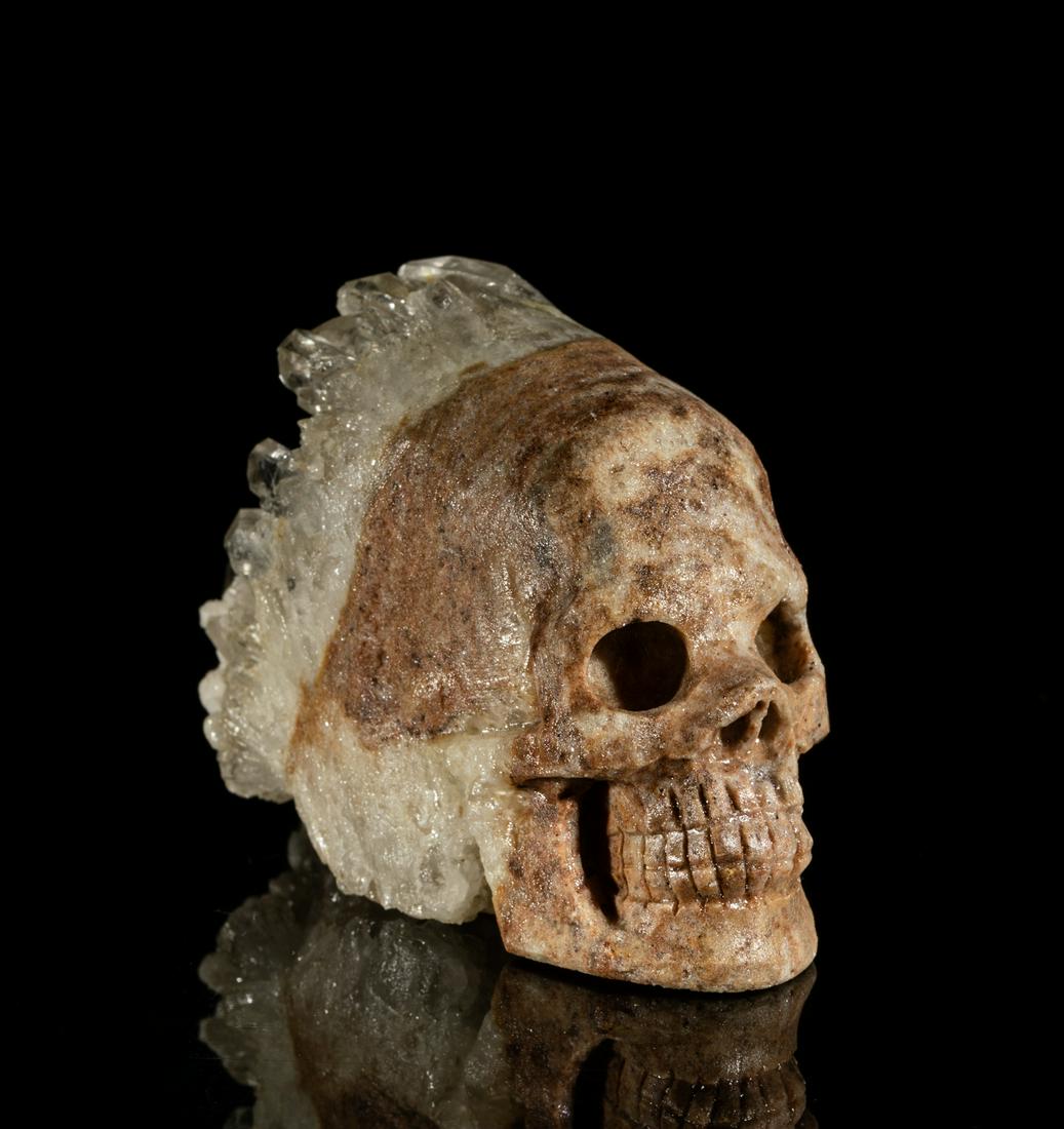 Collectible Rock Crystal Skull Sculpture: Special rock crystal carved skull sculpture with cluster type headdress. 3inch L, 1.65inch W, 2.15inch H.