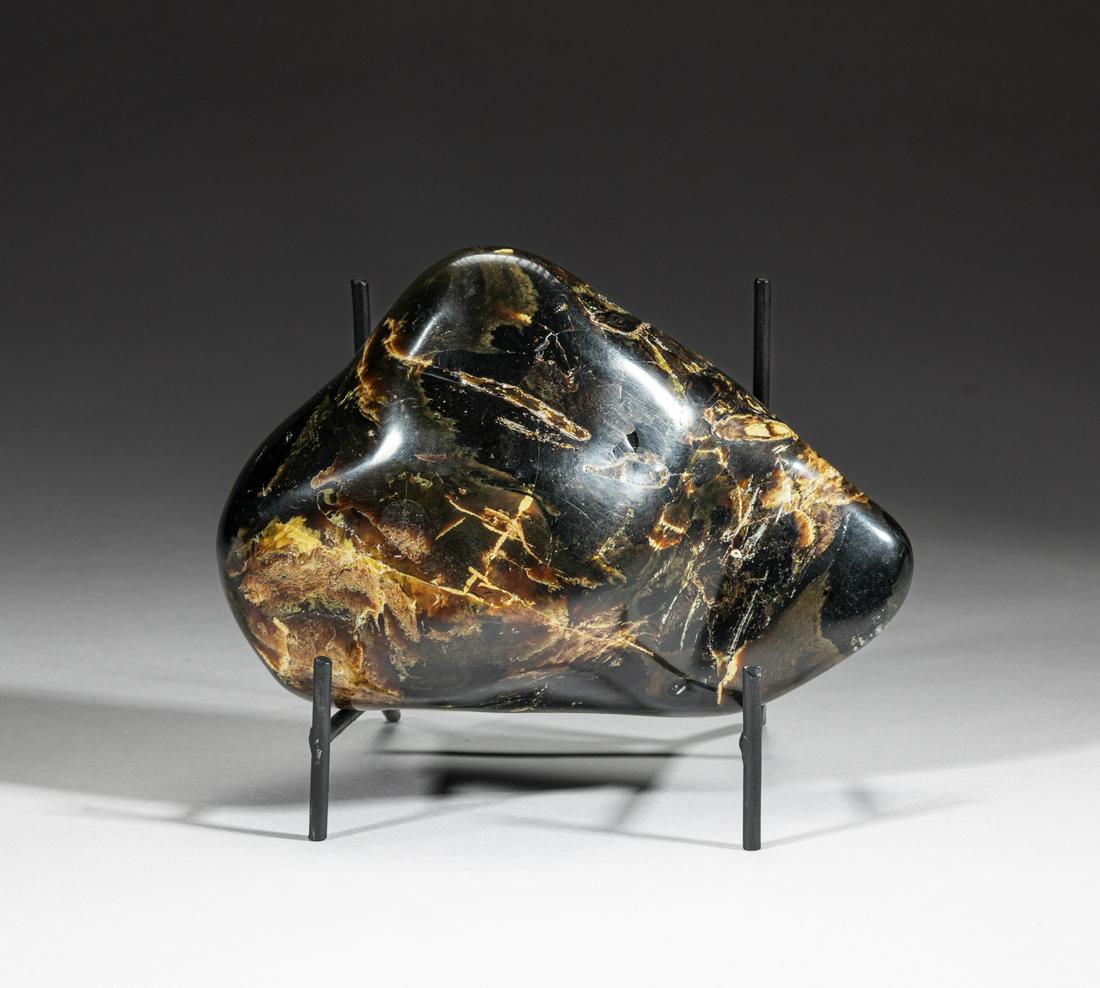 Large Nature Amber Table Sculpture: Large rare amber sculpture, the surface well smoothed, with stand. 6.5inch L, 4.4inch W, 4.2inch H (w/ stand).