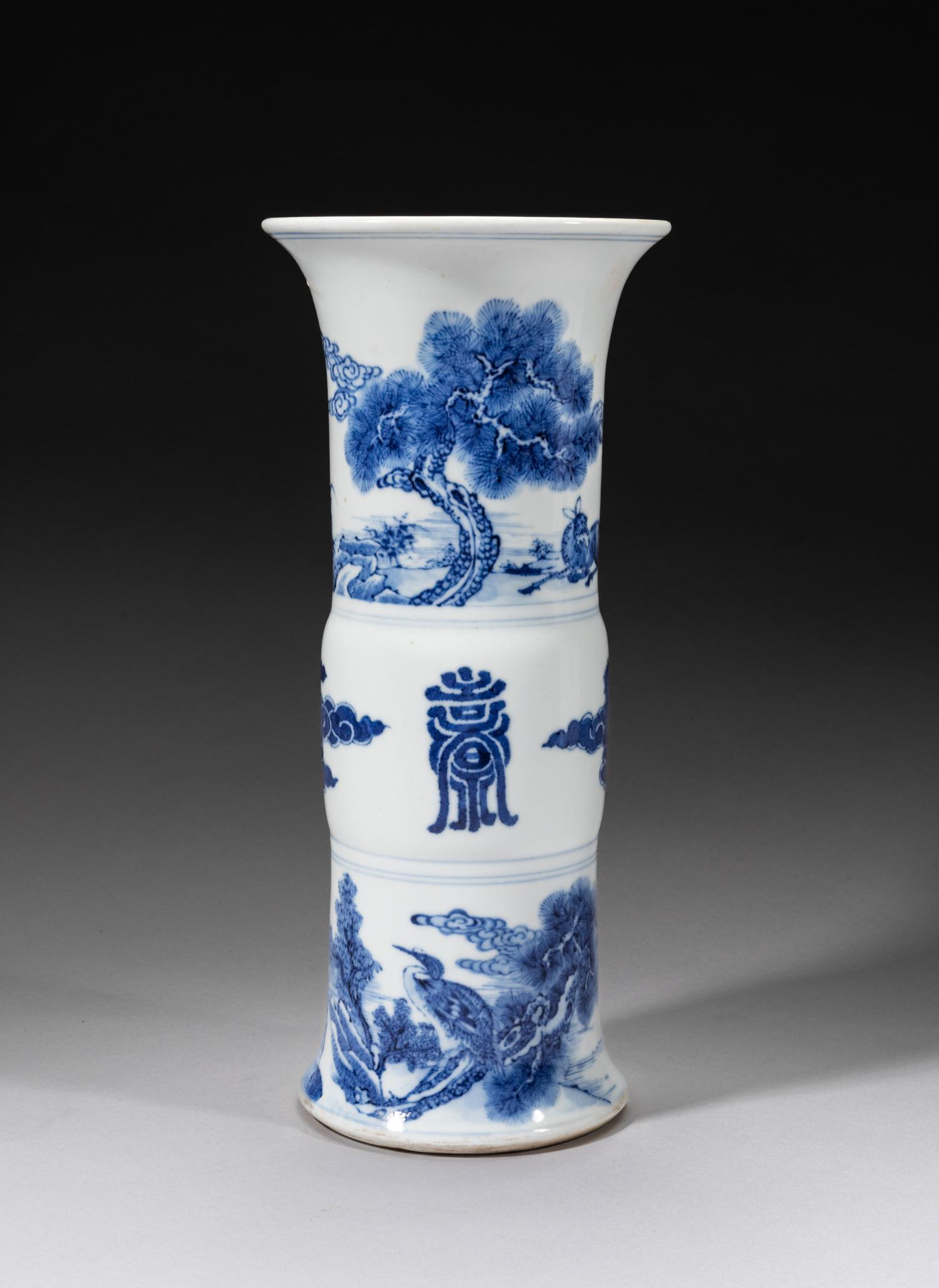 Chinese Blue & White Beaker Vase: Supported on a slightly splayed foot with a central bulb rising to a flaring rim, decorated with shou characters and cloud scrolls on the central, the neck with pine, crane and deer and the foot with 