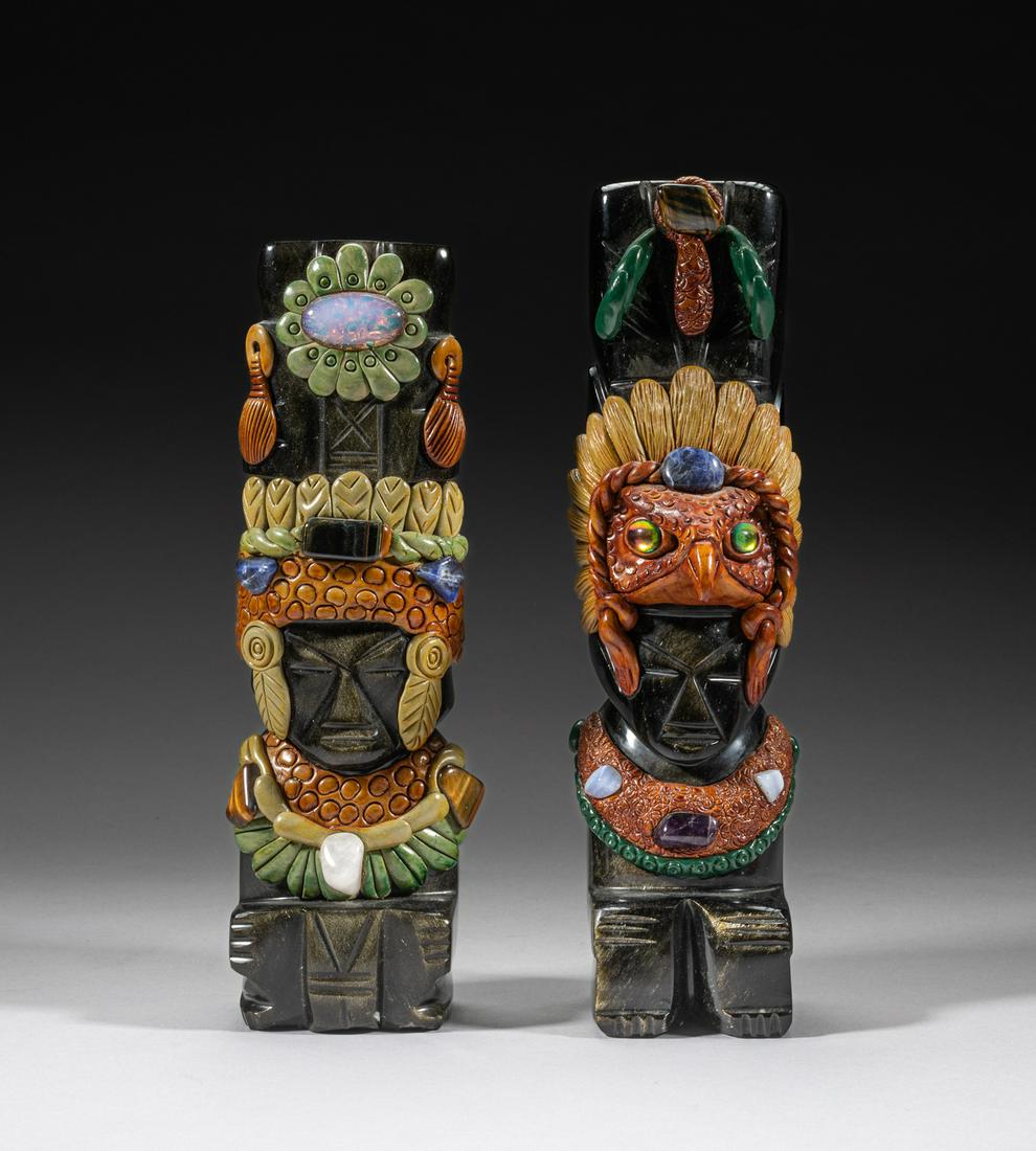 Mexico Aztec Style Gem Stone Sculpture: Two stone Aztec style sculptures, modeled in tribal chief form, carved with colorful headdress and necklace featuring inlaid gemstones, including crystal, amethyst, tiger eye stone and moonstone. 8.5i