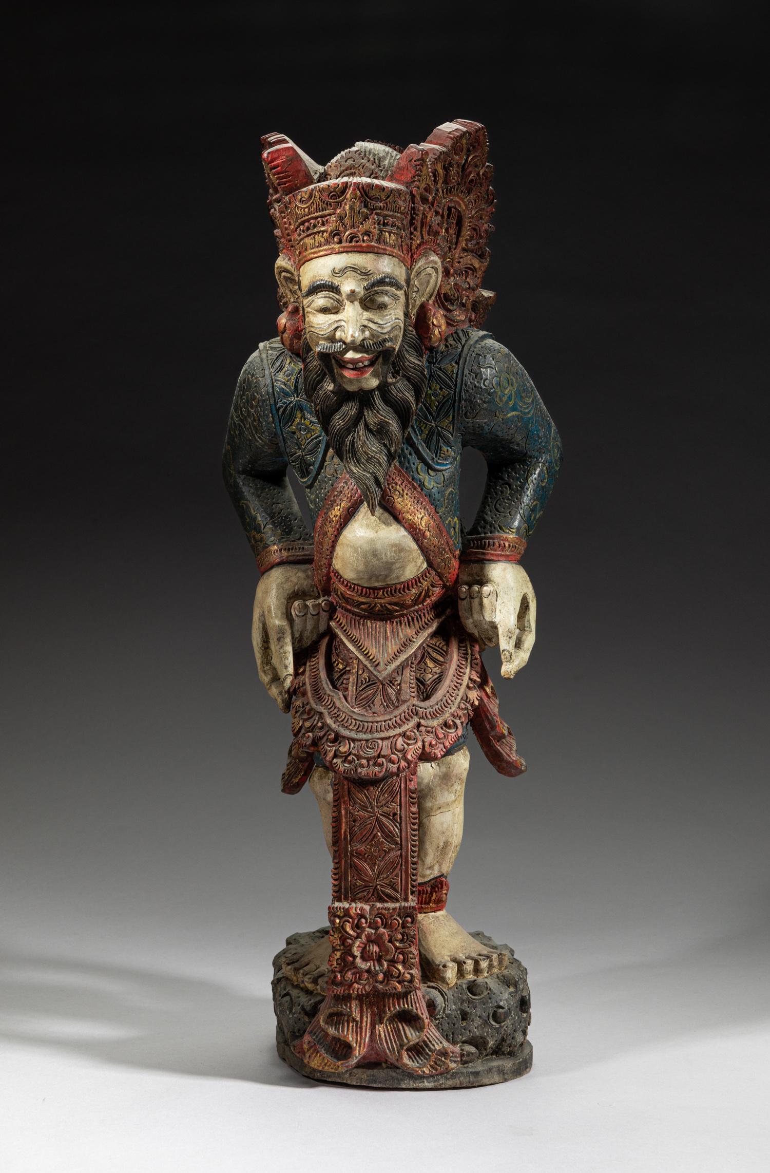 Antique Thai Burmese Ramayana Folk Sculpture: Collectible Thai Burmese Ramayana folk wood sculpture, the mythical figure carved with bulging eyes, protruding nose and bushy beard, the robe carved with stylized floral pattern. 18.5inch H, 7inch L,