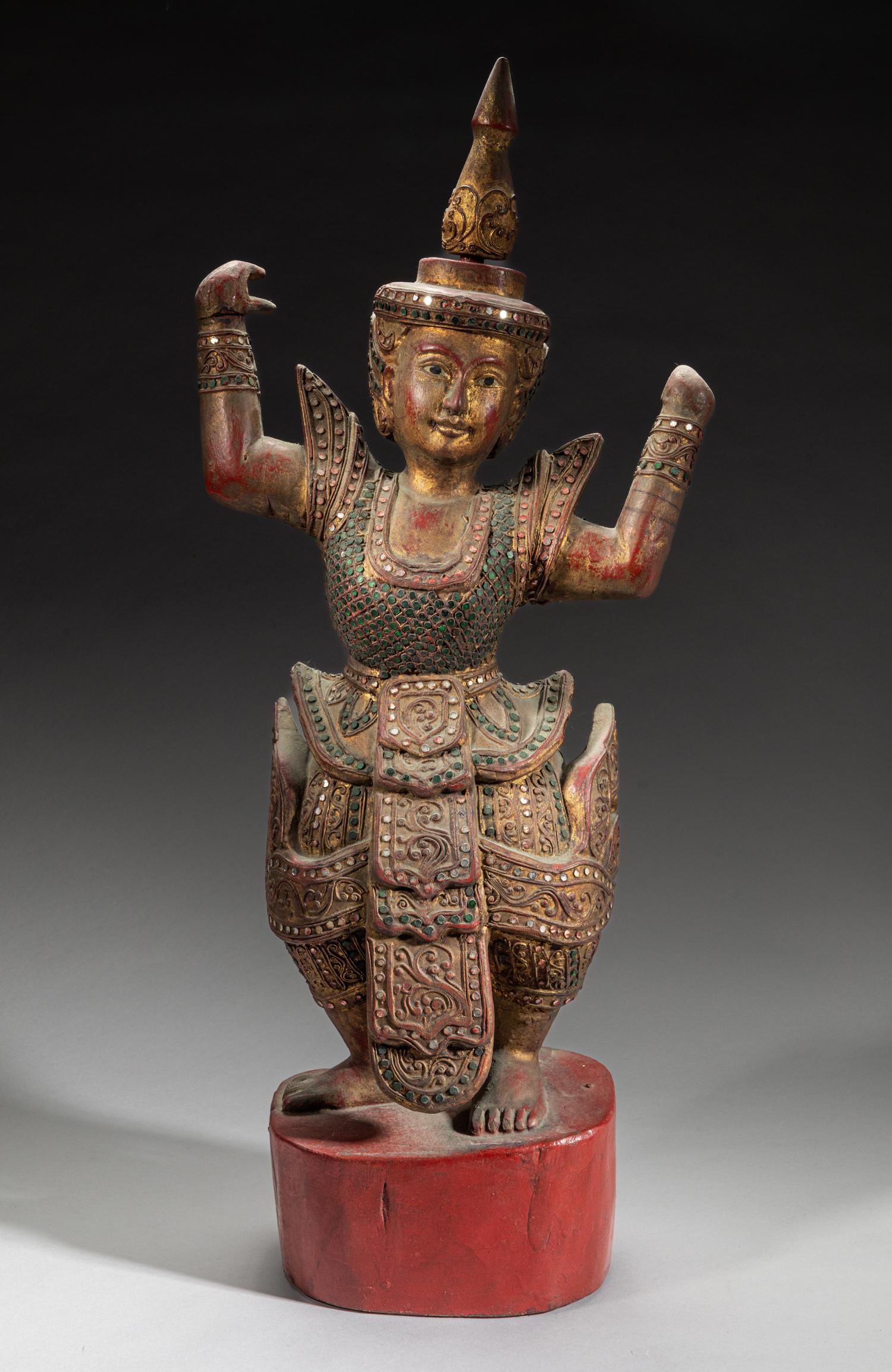 Large Thailand Painted Wood Sculpture: The Thai wood figure sculpture carved in dancing pose, the face with serene expression surmounted with a tall diadema. 24inch H, 10.5inch L, 5inch W,