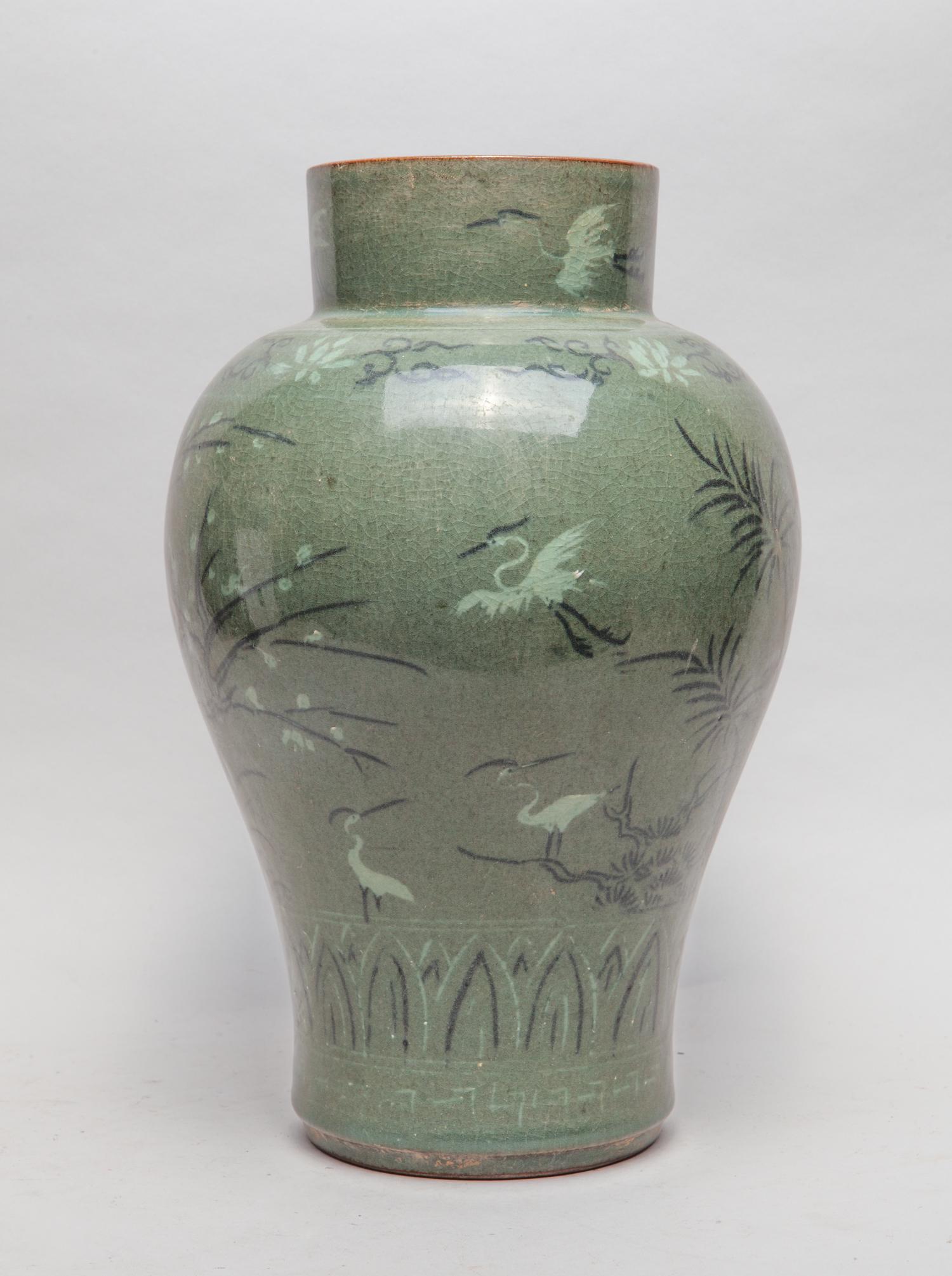 Lg Korean Porcelain Vase: Of tapering ovoid form with a columnar neck, the exterior painted with cranes amid bamboo and plum blossom tree between bands of lotus scrolls and overlapping lotus petals, against an olive-green grou