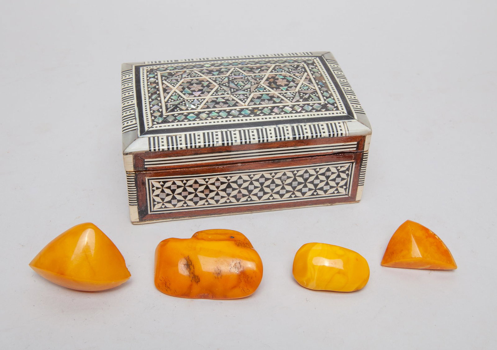 Antique English Amber Brooch w/ Bone Box: Group of four English style amber brooches, with a box decorated with bone and mother of pearl in geometrical pattern. 2.1inch L, 1.38inch W (largest).