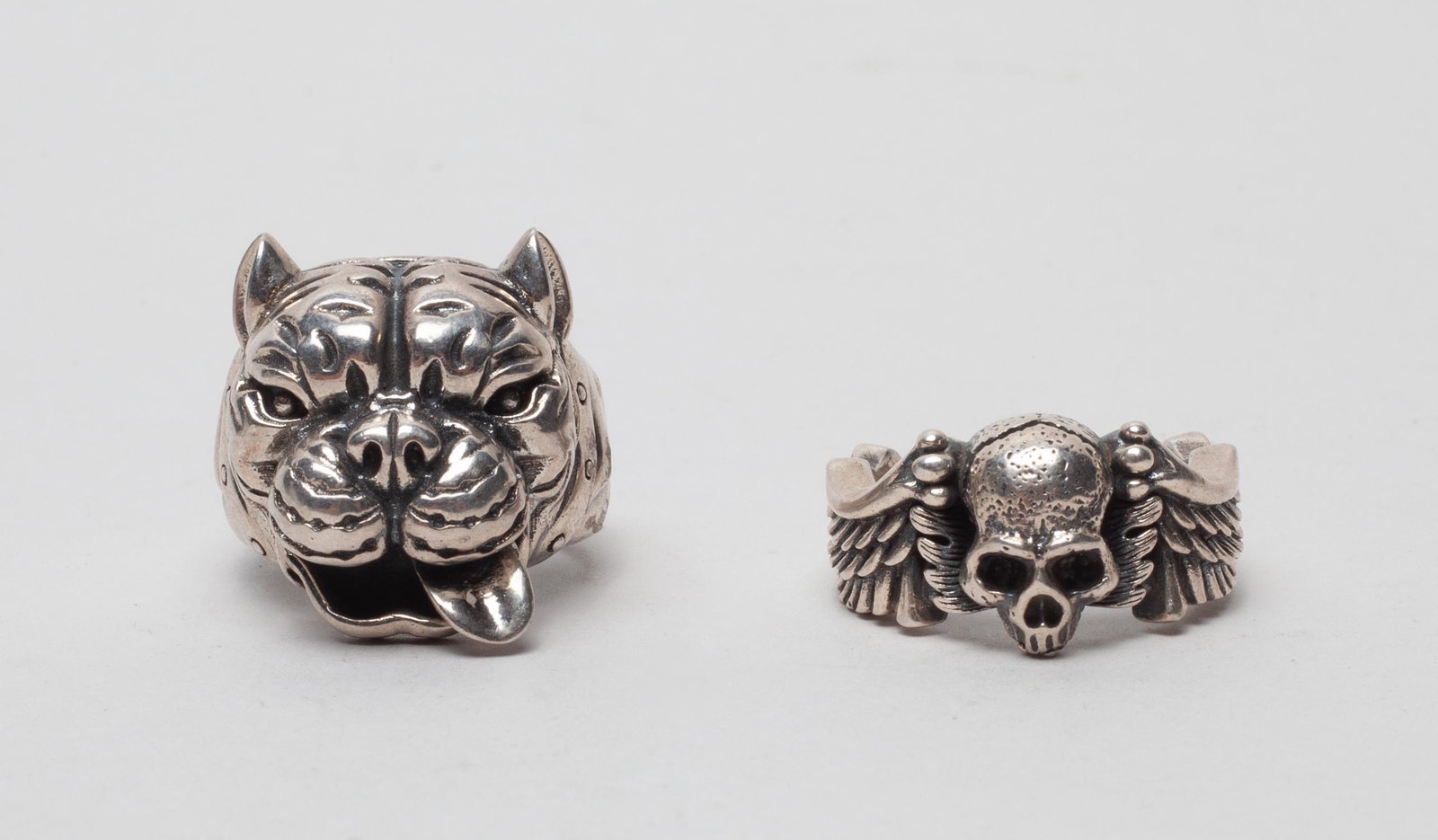 Two Designed Silver Ring: Two special silver rings, one designed in tiger head form and the other as a skull and a pairs of wings, both marked S925. US size: 9 (each).