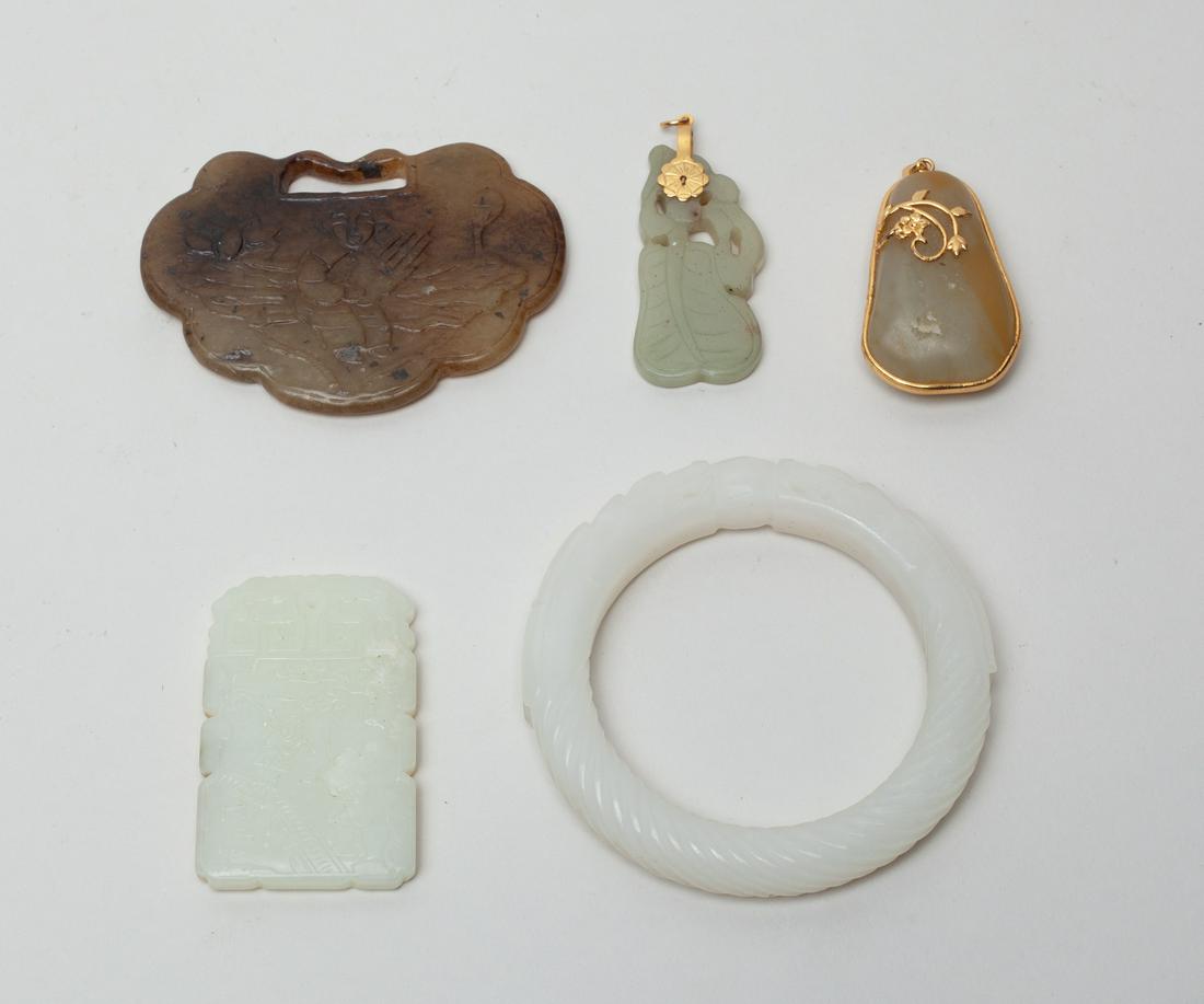 Vintage Chinese Jade Carvings: Including a russet jade pendant with golden-colored bail, a bangle carved with twin dragon heads embracing a ball, a plaque carved with figures in landscape on one side and related inscription on the 