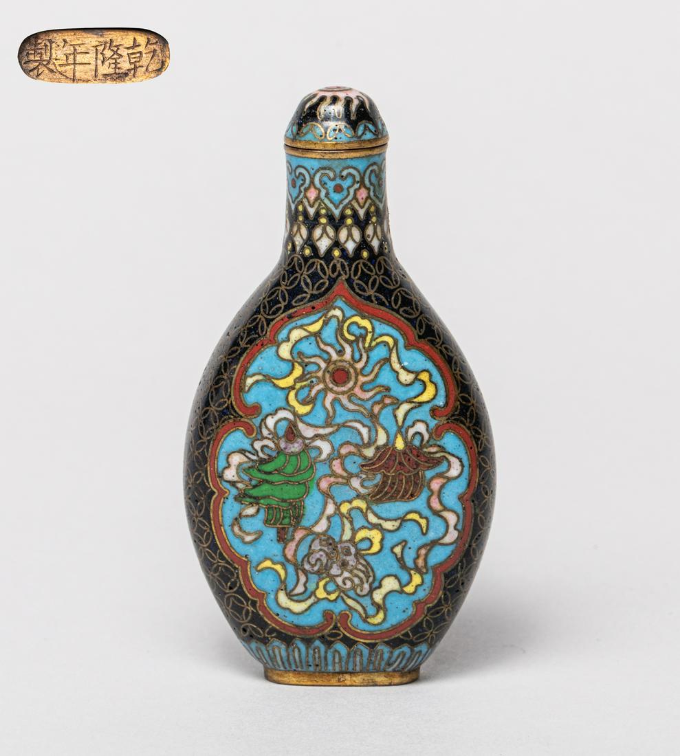 Chinese Cloisonne Snuff Bottle: Of flat oval form, enameled on either side with a medallion of traditional Chinese symbols, against a black ground suffused with coin motif, the bottom carved with a four-character mark, with a matche
