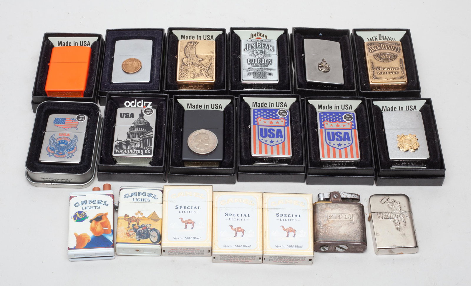 Camel, Marlboro & Zippo Lighters: A large group of Camel, Marlboro and zippo lighters. Size varies.