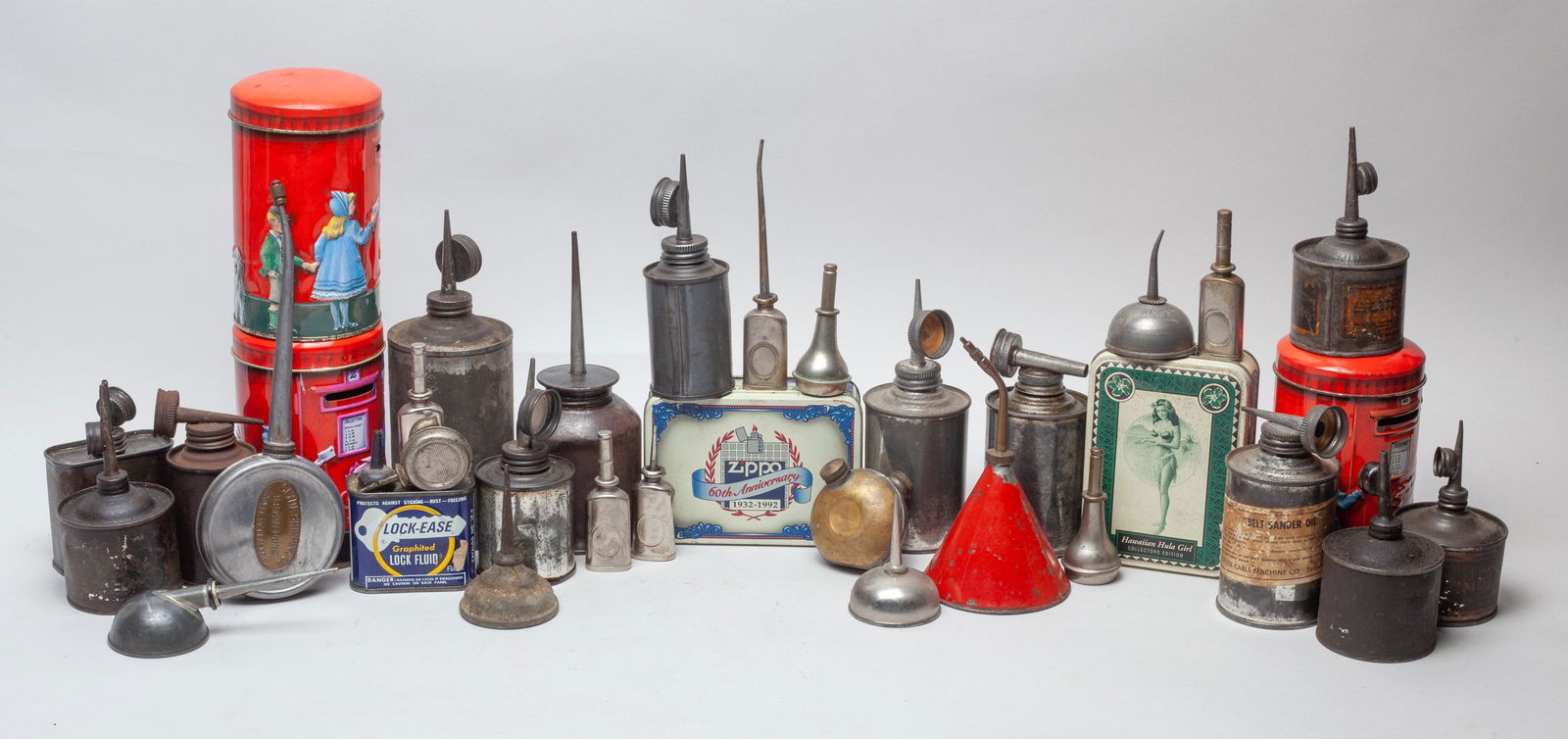 Vintage Metal Coin Banks & Oil Cans: A large group of motor oil can thumb pump oil dispenser and coin banks. Size varies.
