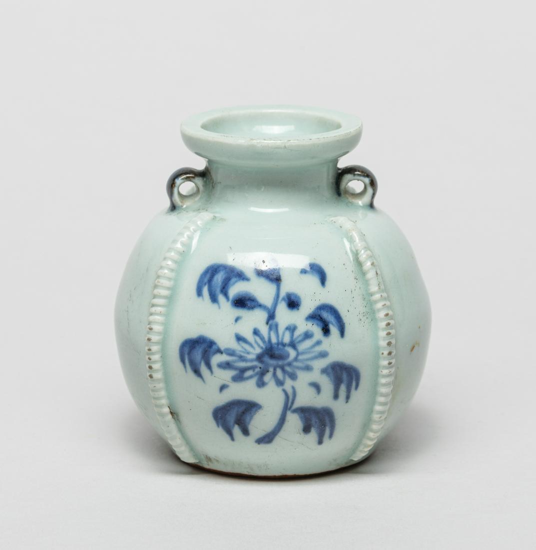 Chinese Blue & White Poecelain Water Pot: Th globular body rising to a waisted neck and dished rim, the exterior painted with flowers and set with raised borders. 3.1inch H, 3inch W.