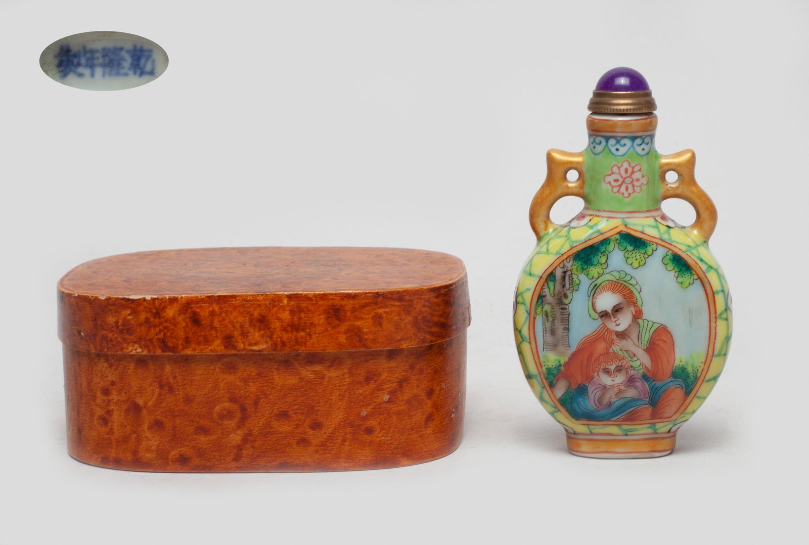 Chinese Famille Rose Porcelain Snuff Bottle: Of flattened vase form, one side painted with a female and a boy, the reverse inscribed with related passages, against crackled yellow ground with flowers, the bottom marked with four characters, with