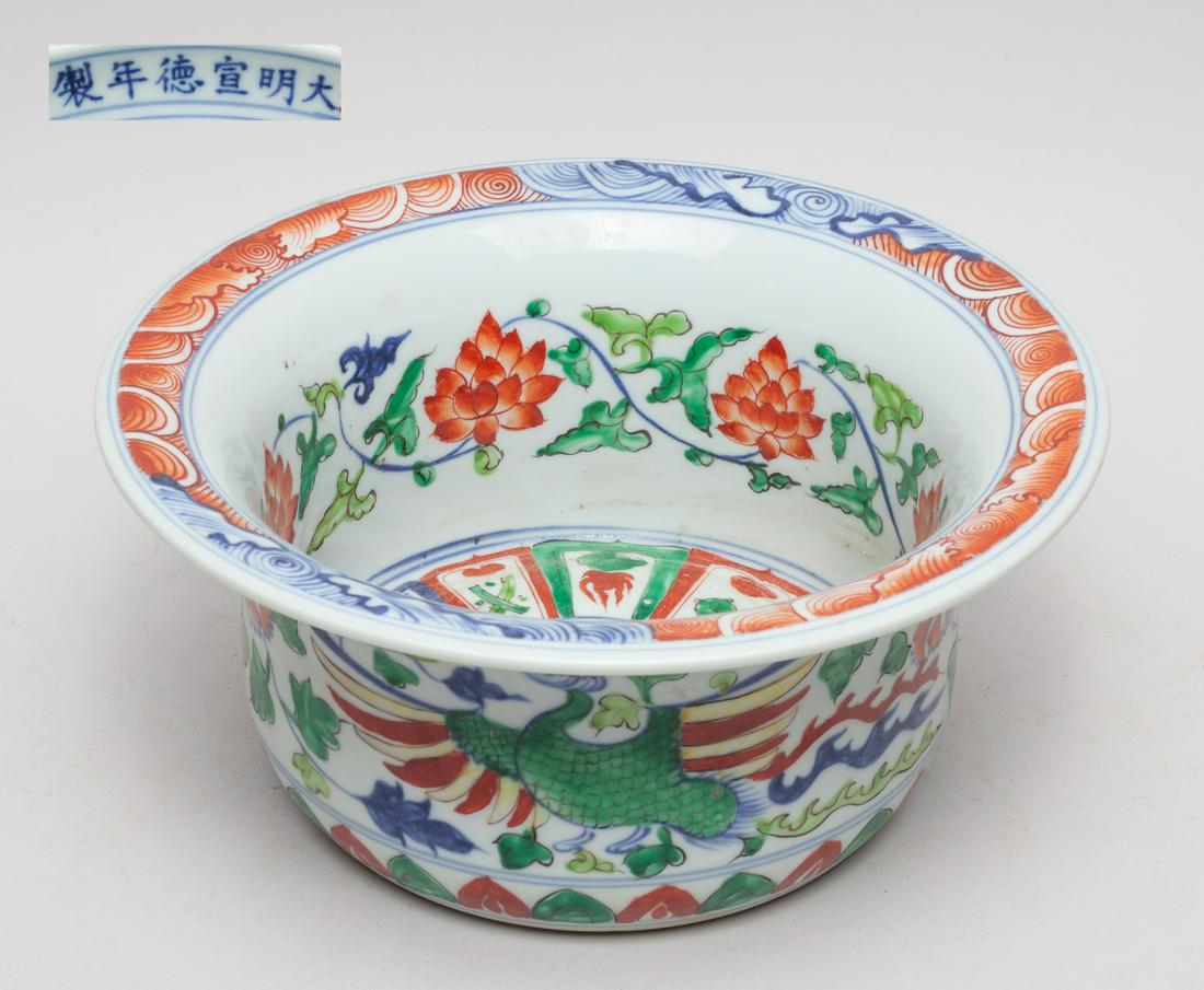 Chinese Famille Rose Porcelain Large Bowl: Painted on interior centre with a band of lappets embracing a flower, and the sides with meandering lotus sprays, the exterior with a pair of phoenixes among lotus sprays. 10.7inch W, 4.7inch H.