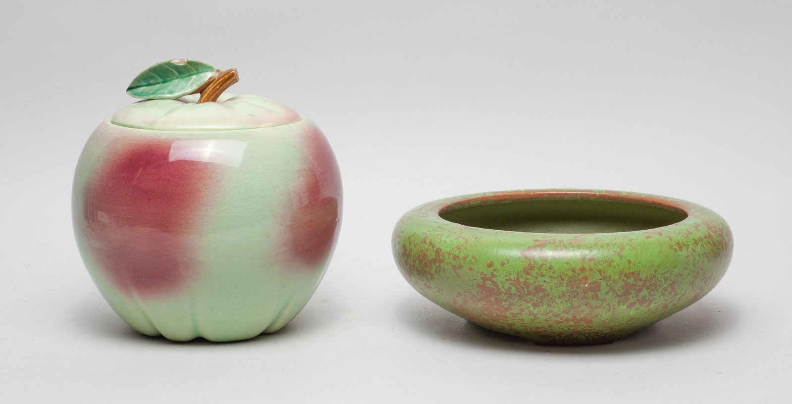 American Glazed Porcelain Pieces: Including a green glazed washer and a peach form covered jar. 10inch W, 3.5inch H (washer size).