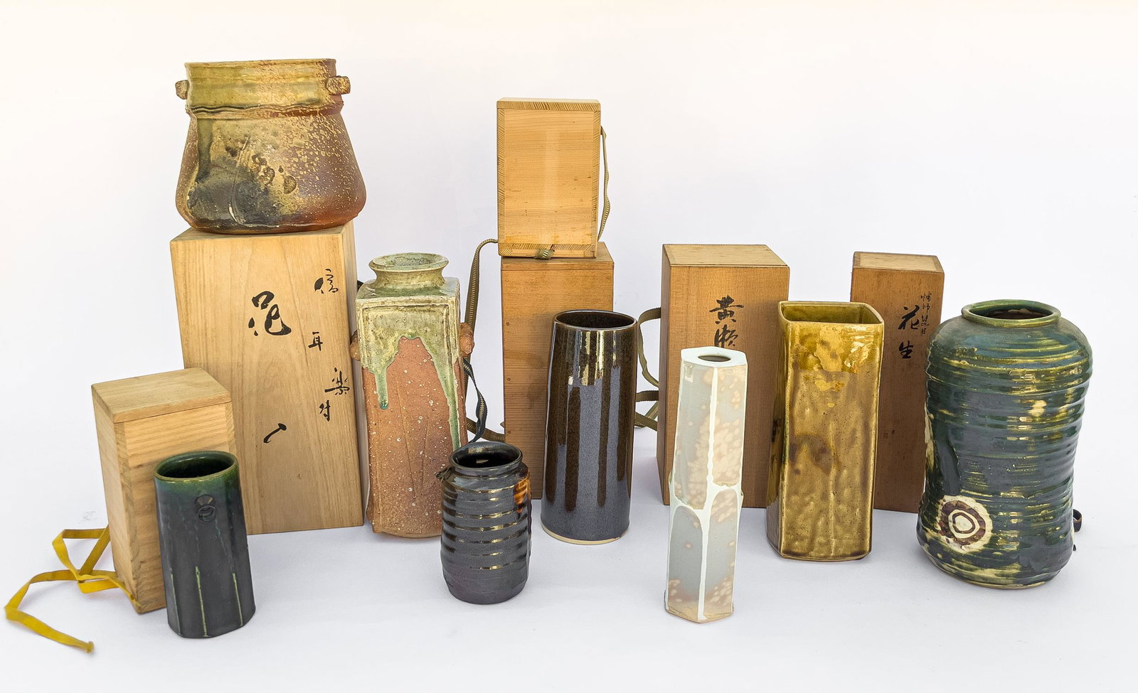Vintage Japanese Porcelain Vases: Group of 8 Japanese style glazed porcelain vases in various shapes, some vases with boxes. Approx. 10-5.3inch (largest).