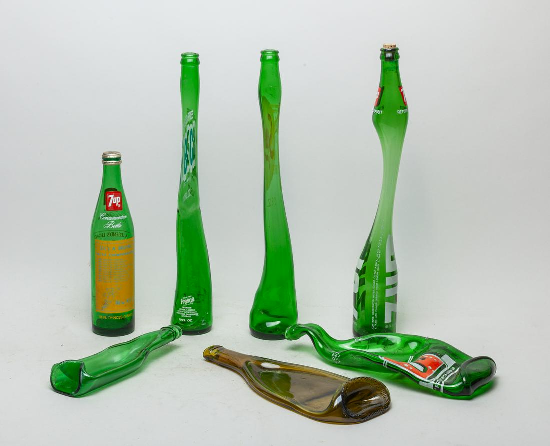 7 Up & Art Glass Bottle: Set of 7 up & art glass bottles. Size Approx.: 17.5 inch H. (largest).