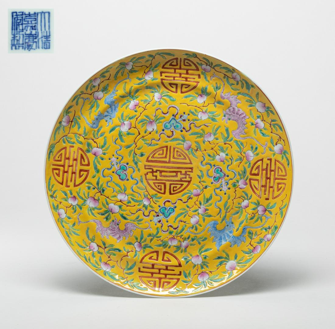Lg Chinese Famille Rose Porcelain Plate: The interior enameled with dense leafy peach branches on bright yellow ground, interspersed with bats, shou characters and ruyi, the exterior painted five iron-red bats, the bottom with a six-characte