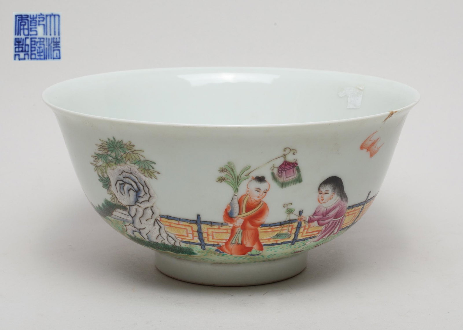 Massive Chinese Porcelain Bowl: The exterior painted with five boy playing in garden setting, interspersed with three bats, the bottom with a six-character mark. 9inch W, 4.2inch H.