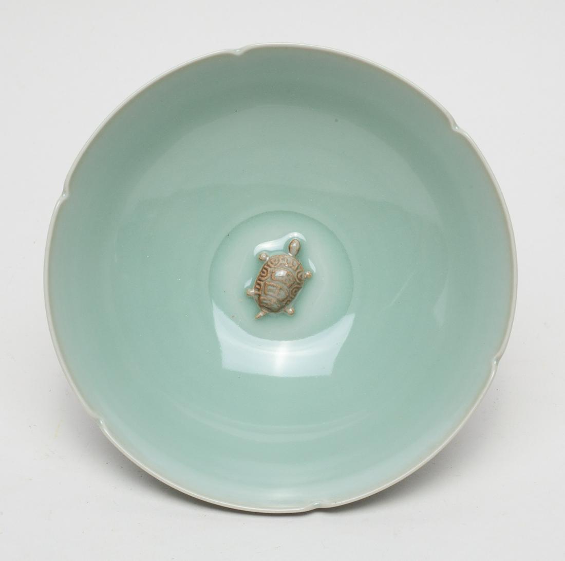 Special Korean Porcelain Bowl: The interior centre molded with a tortoise, covered overall with a celadon glaze. 6inch W, 2.1inch H.