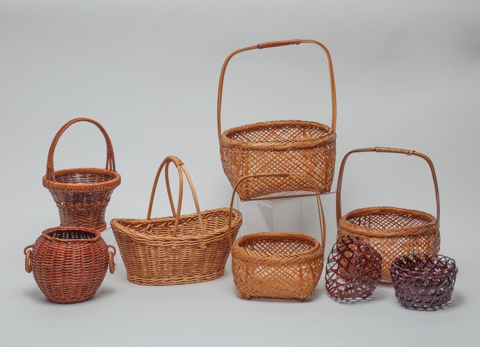 Japanese Hanakago Ikebana Baskets: Group of 8 Japanese Hanakago Ikebana rattan/bamboo baskets. approx. 10.5-7.75 inch (largest).